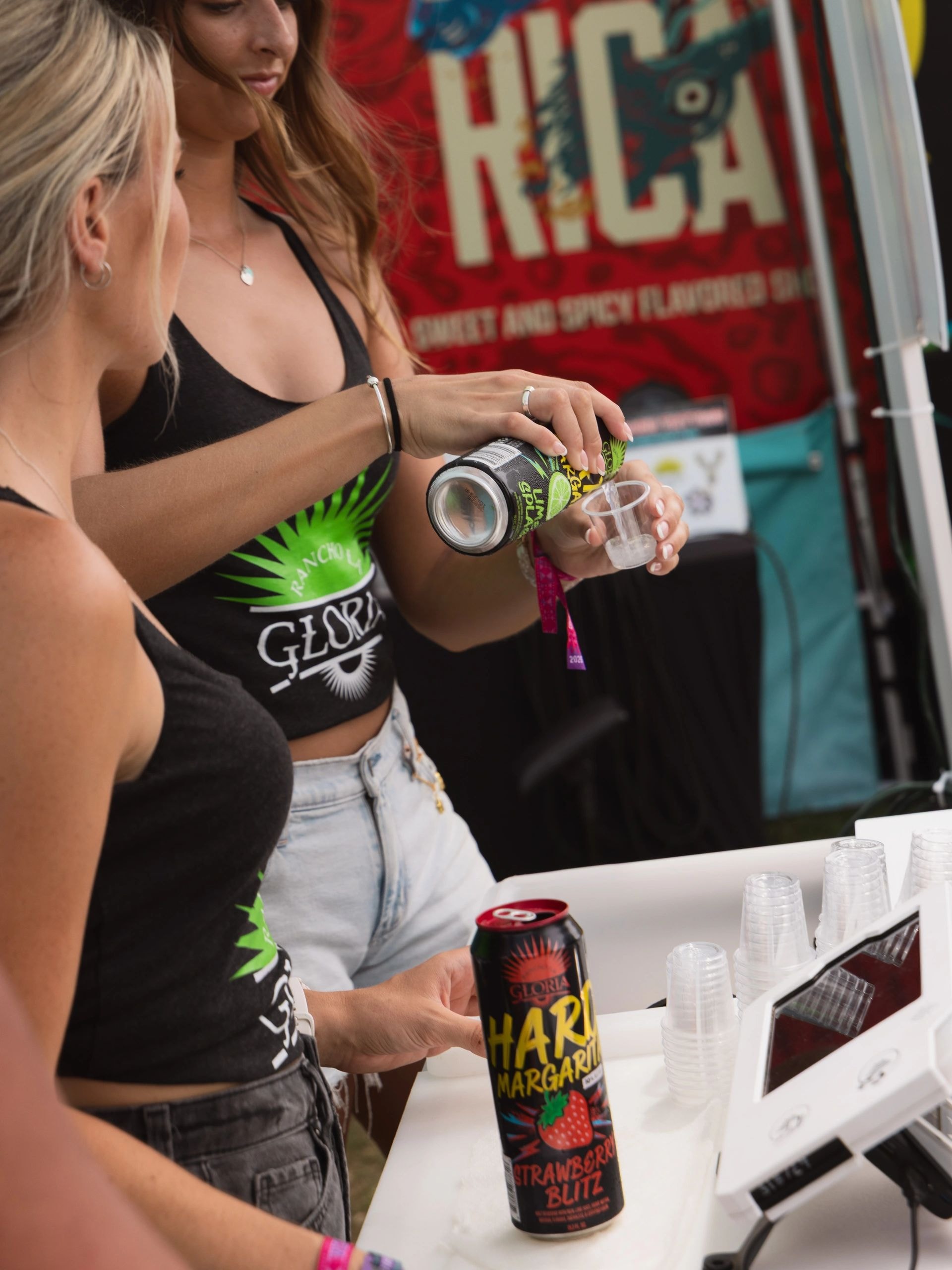 Branded beverage sampling booth at a live event